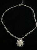 Rock crystal necklace with a flower in the center
